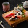 sushi on brown wooden board